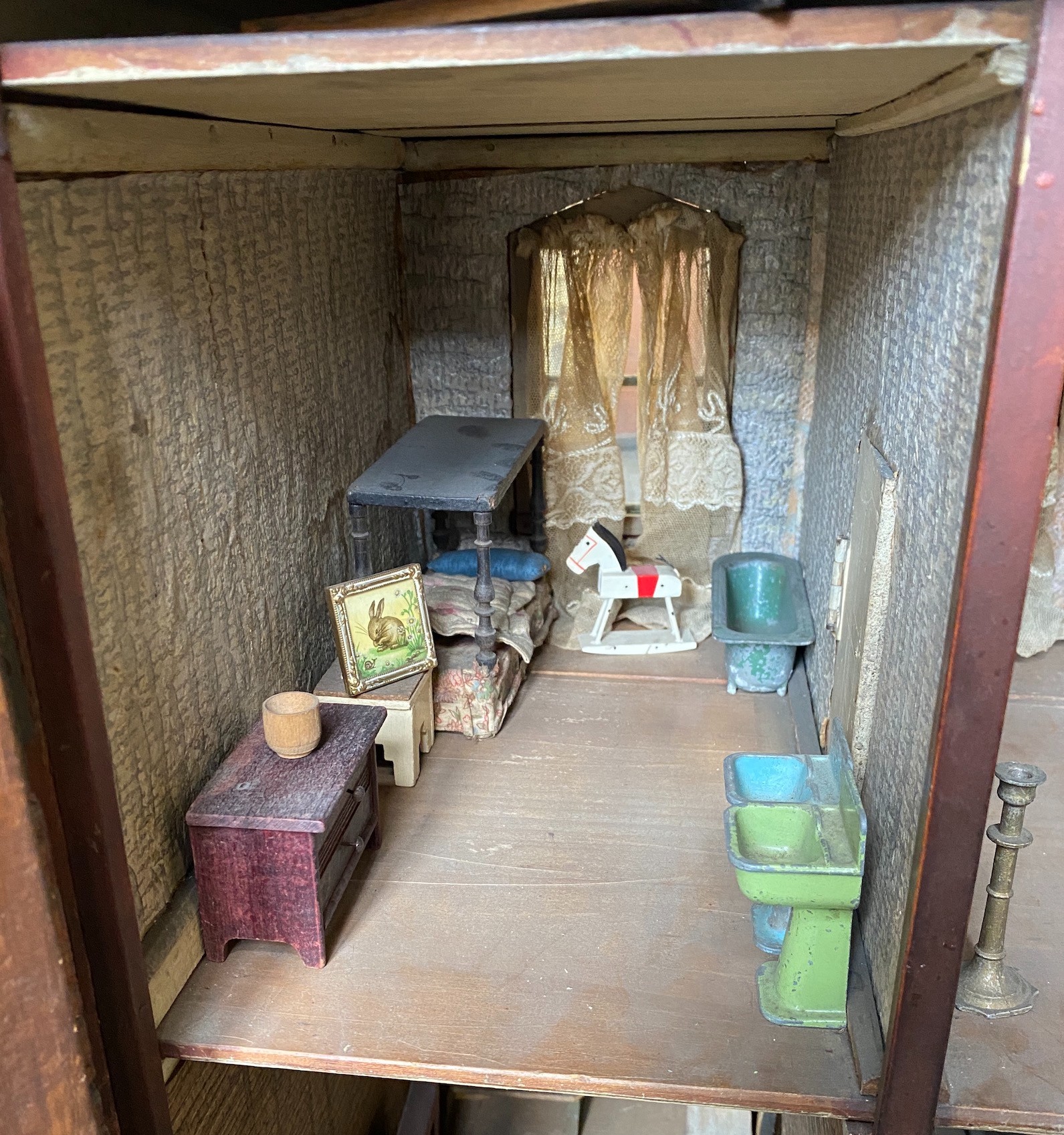 A back-opening furnished English dolls’ house, late 19th century, 74cm high